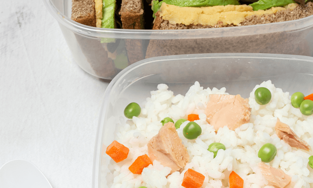close-up of cear plastic storage container with rice and vegetables