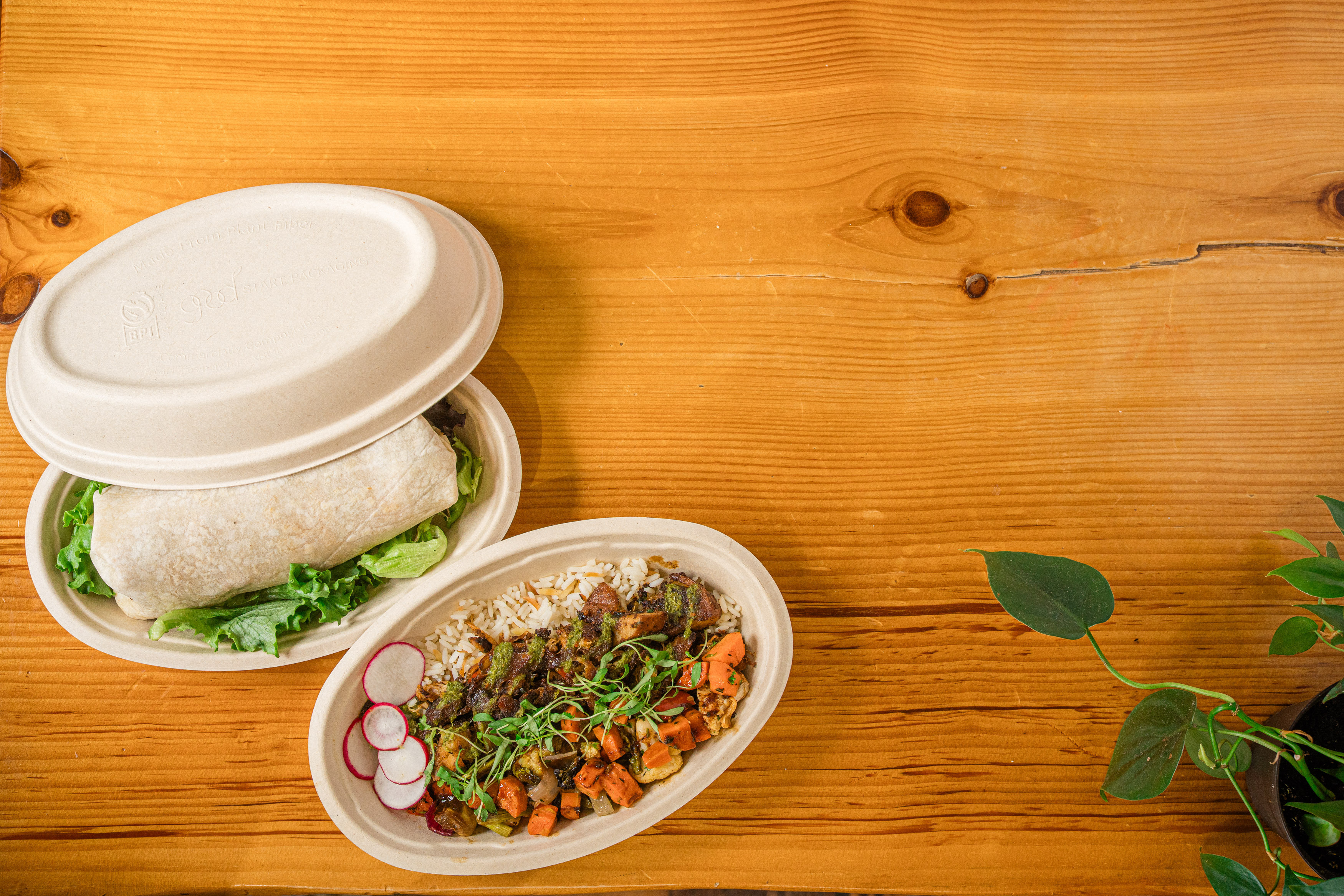 burrito and rice bowl in fiber containers
